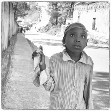 Portrait of little girl with a sardine.