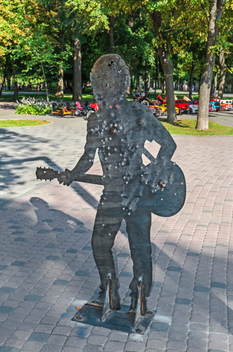 Silhouette of guitarist made from metal plate and pierced Fotoğraf